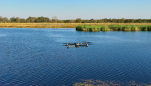 drone flying over a watering hole